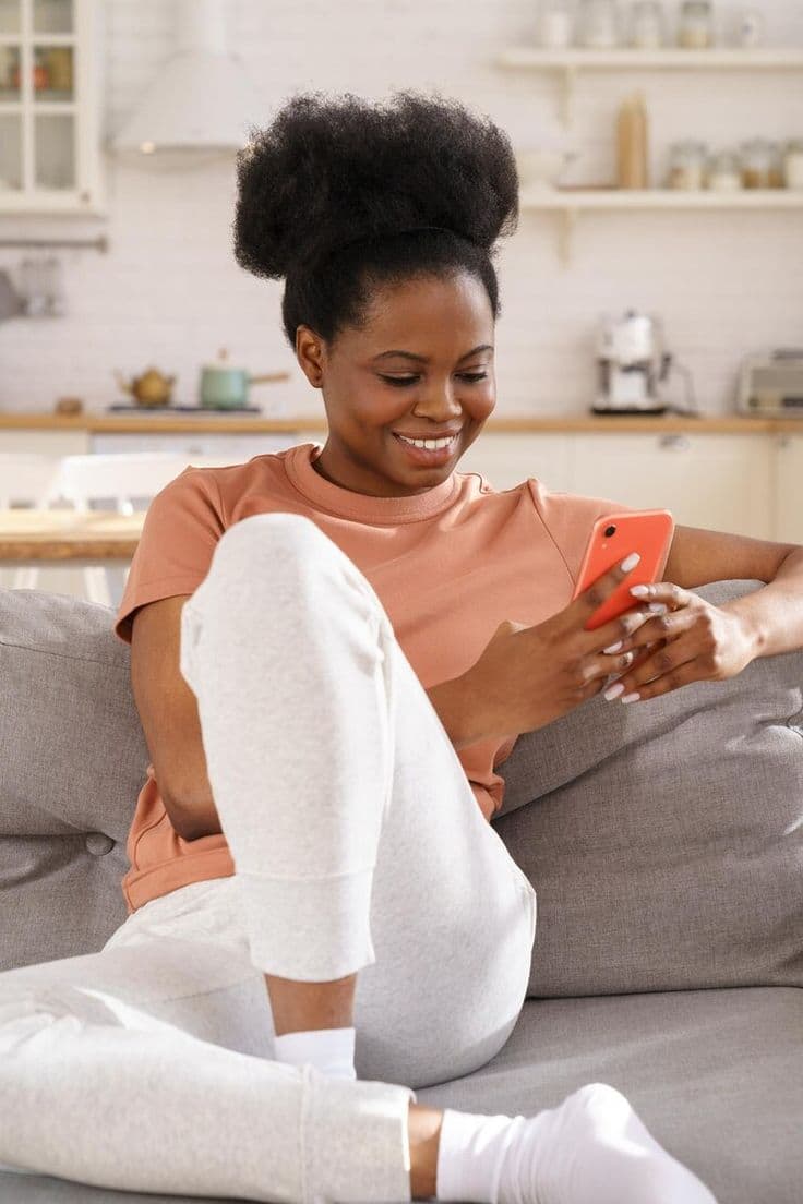 A buyer confidently checking their phone at home